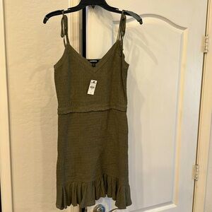 Express brand dark green dress with specs of gold.